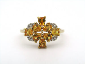 9K gold yellow sapphire and diamond ring.