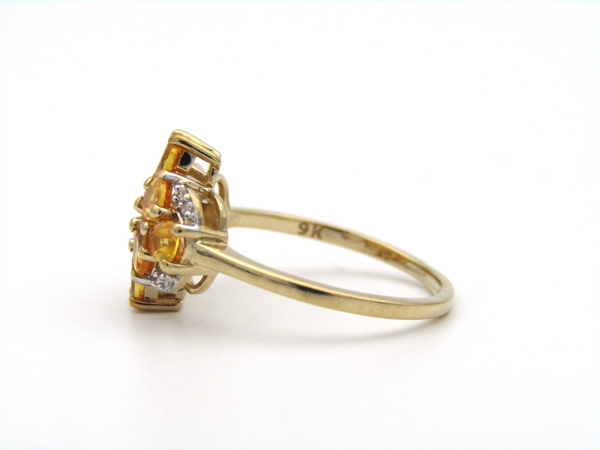 9K gold yellow sapphire and diamond ring.