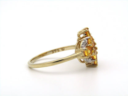 9K gold yellow sapphire and diamond ring.