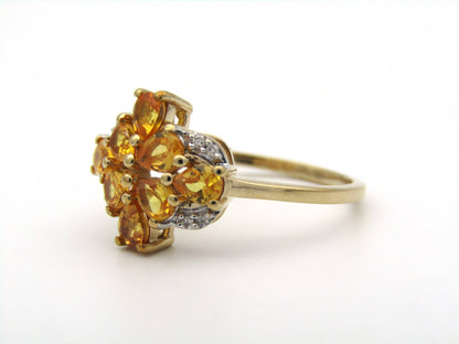 9K gold yellow sapphire and diamond ring.