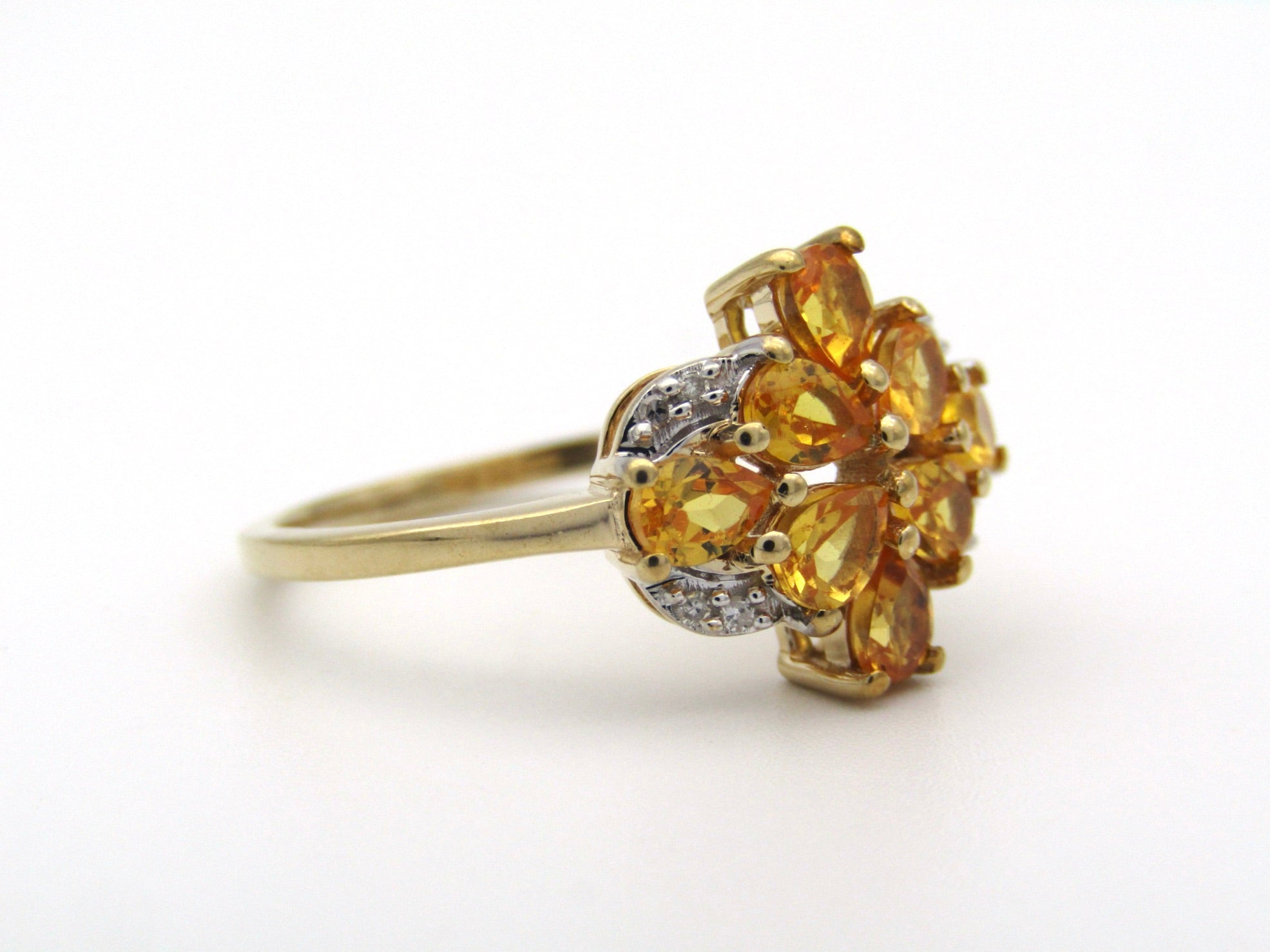 9K gold yellow sapphire and diamond ring.