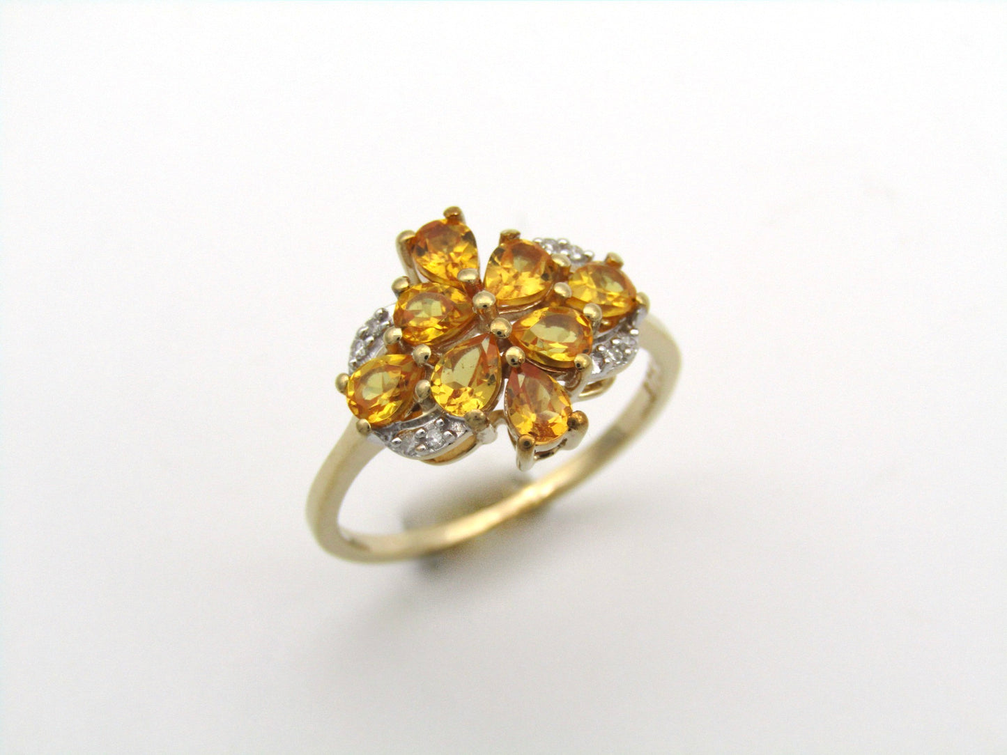 9K gold yellow sapphire and diamond ring.