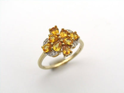 9K gold yellow sapphire and diamond ring.