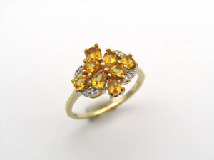 9K gold yellow sapphire and diamond ring.