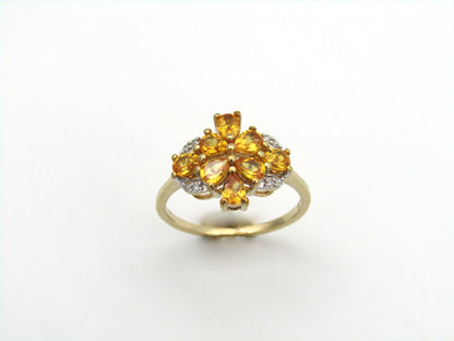 9K gold yellow sapphire and diamond ring.