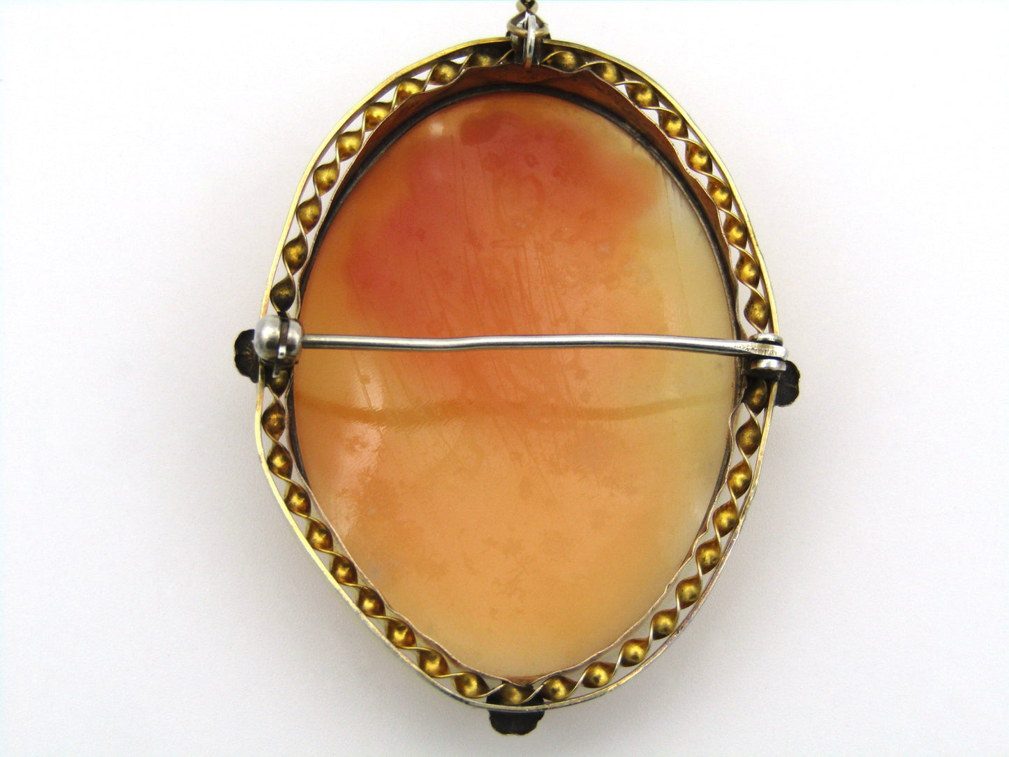 Gold plated shell cameo brooch.