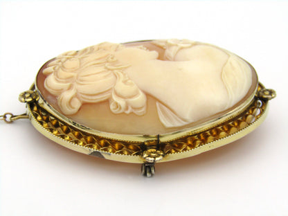 Gold plated shell cameo brooch.