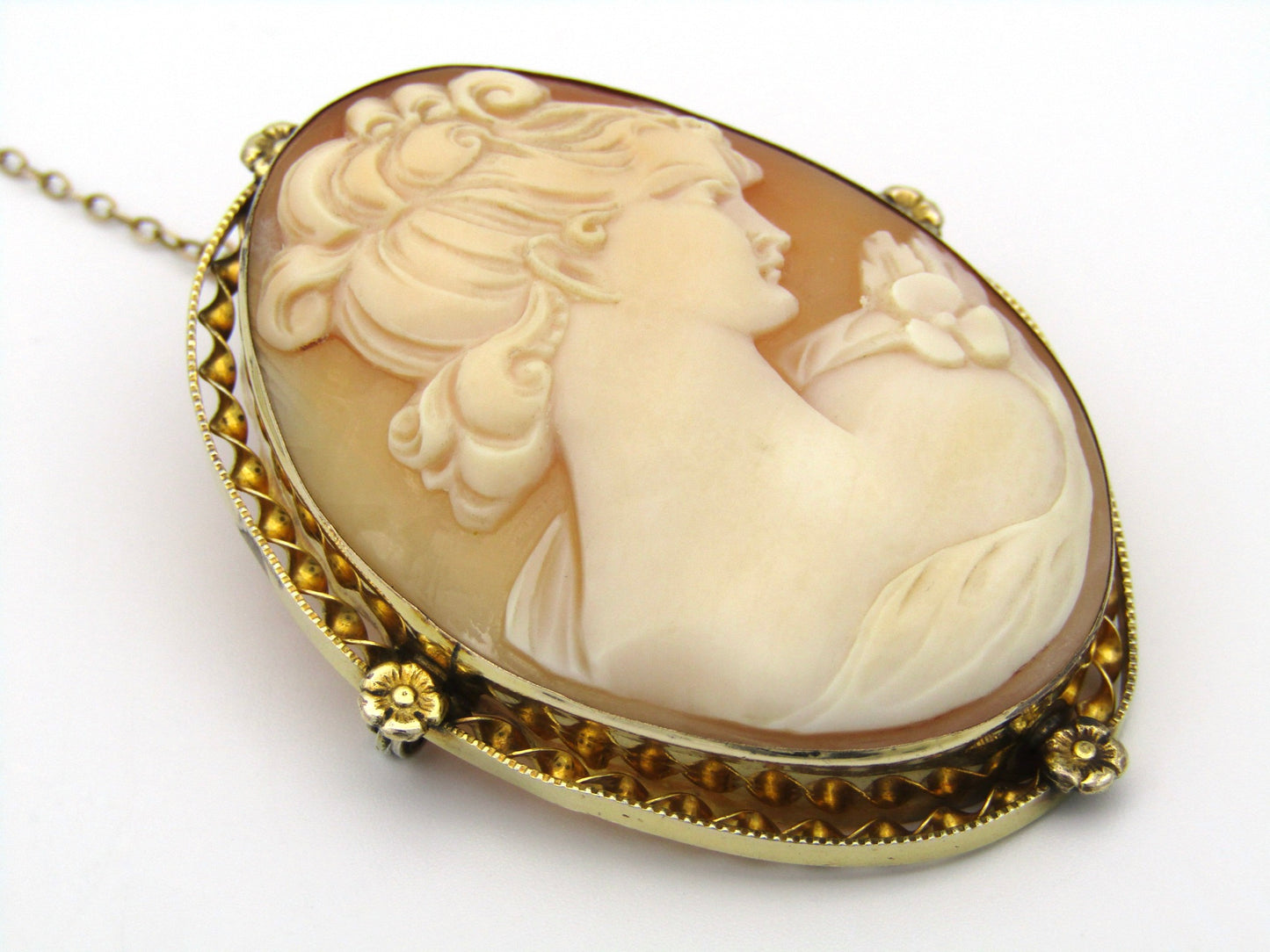 Gold plated shell cameo brooch.