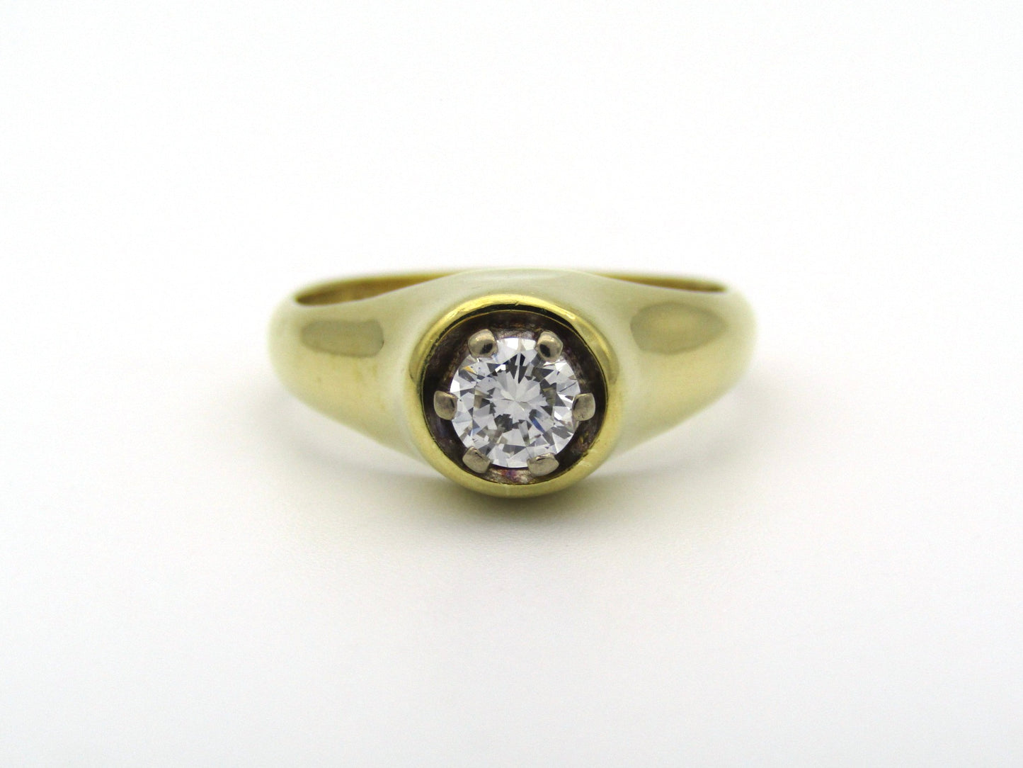 18K gold solitaire diamond ring.