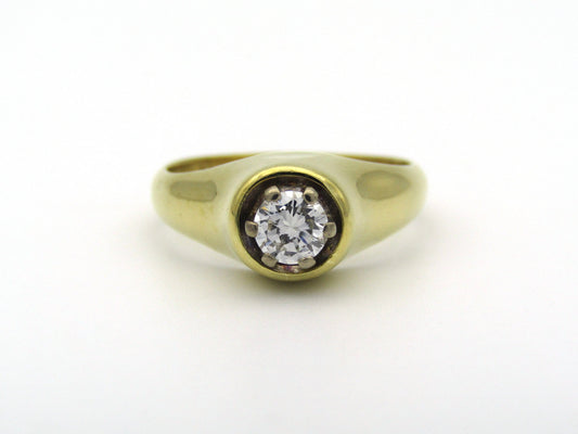 18K gold solitaire diamond ring.