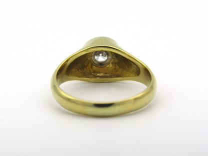 18K gold solitaire diamond ring.