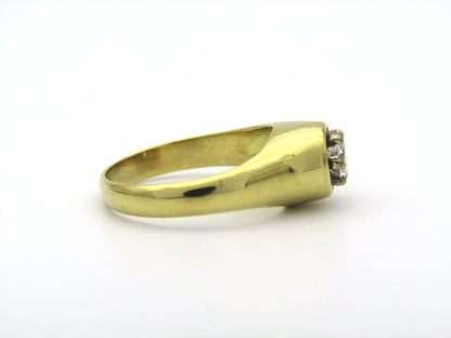 18K gold solitaire diamond ring.