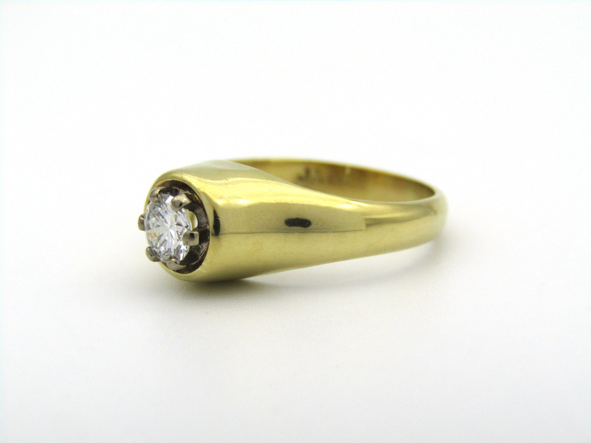 18K gold solitaire diamond ring.