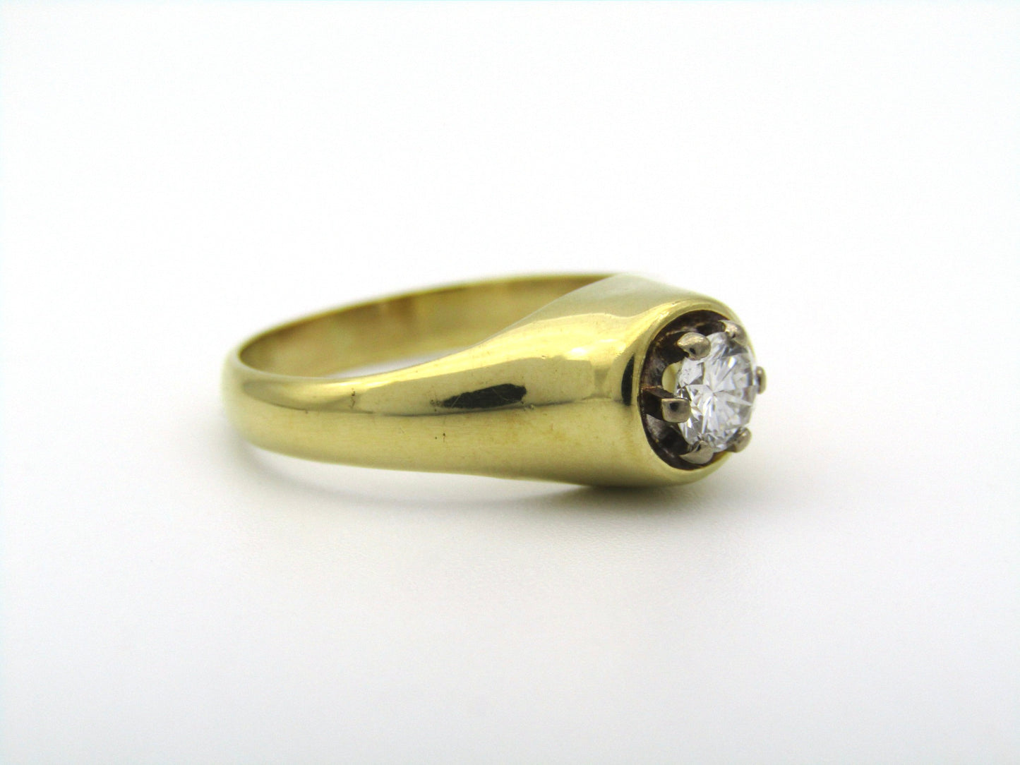 18K gold solitaire diamond ring.