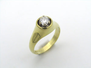 18K gold solitaire diamond ring.