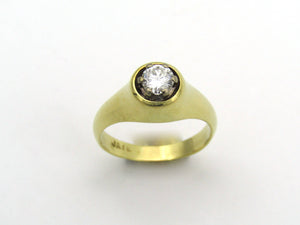 18K gold solitaire diamond ring.