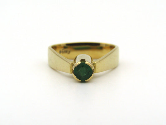 18K gold emerald ring by Erich Frey.