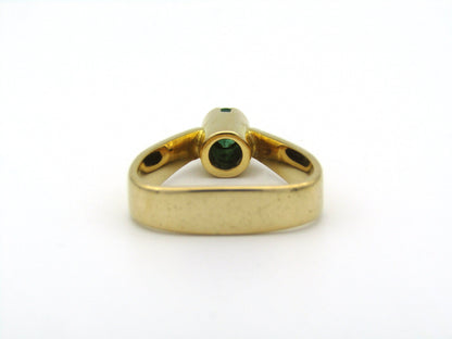 18K gold emerald ring by Erich Frey.