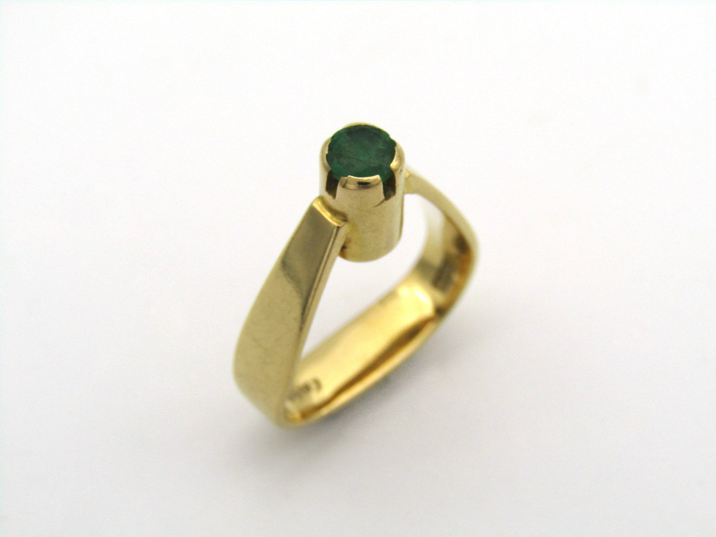 18K gold emerald ring by Erich Frey.