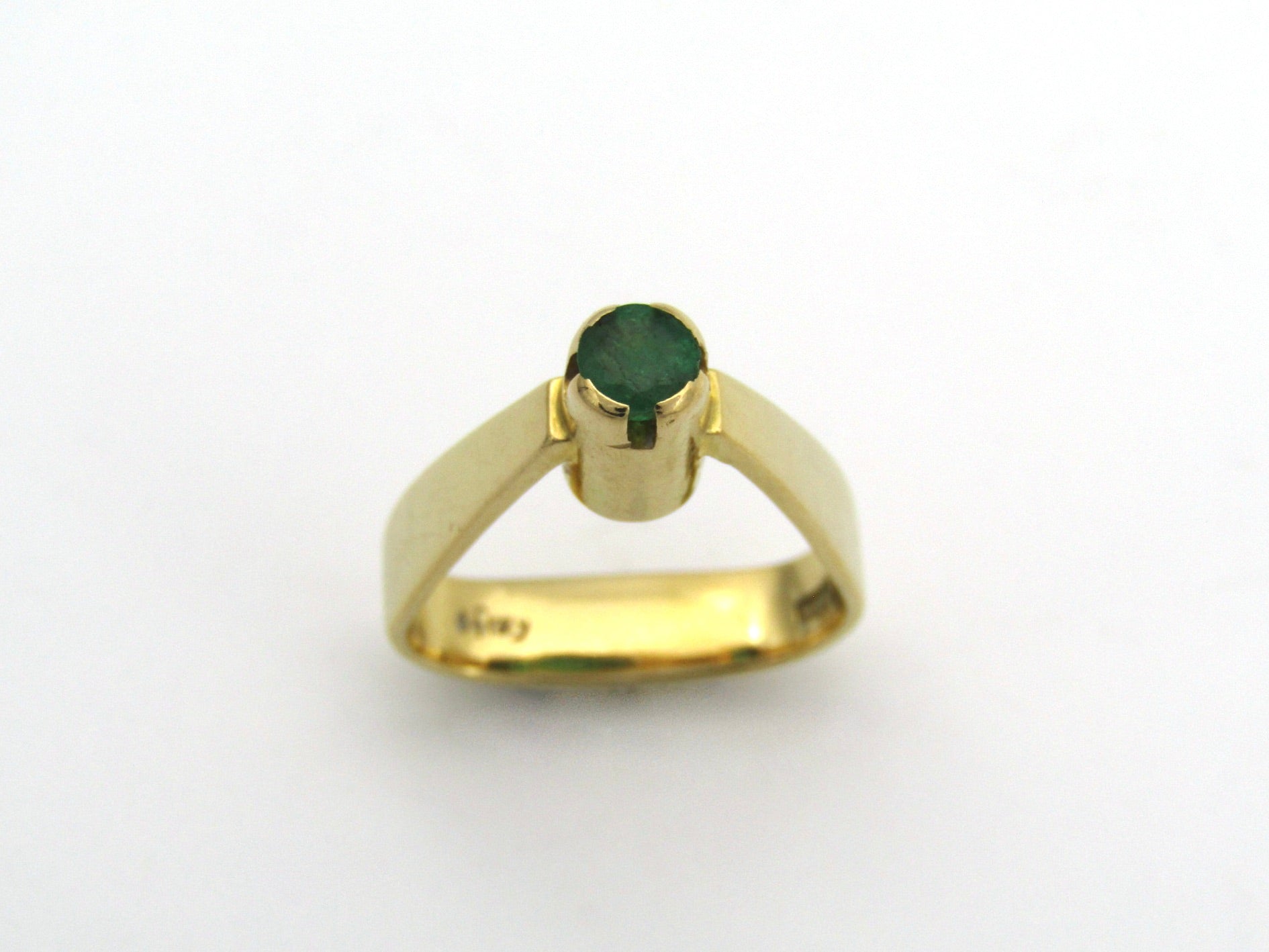 18K gold emerald ring by Erich Frey.