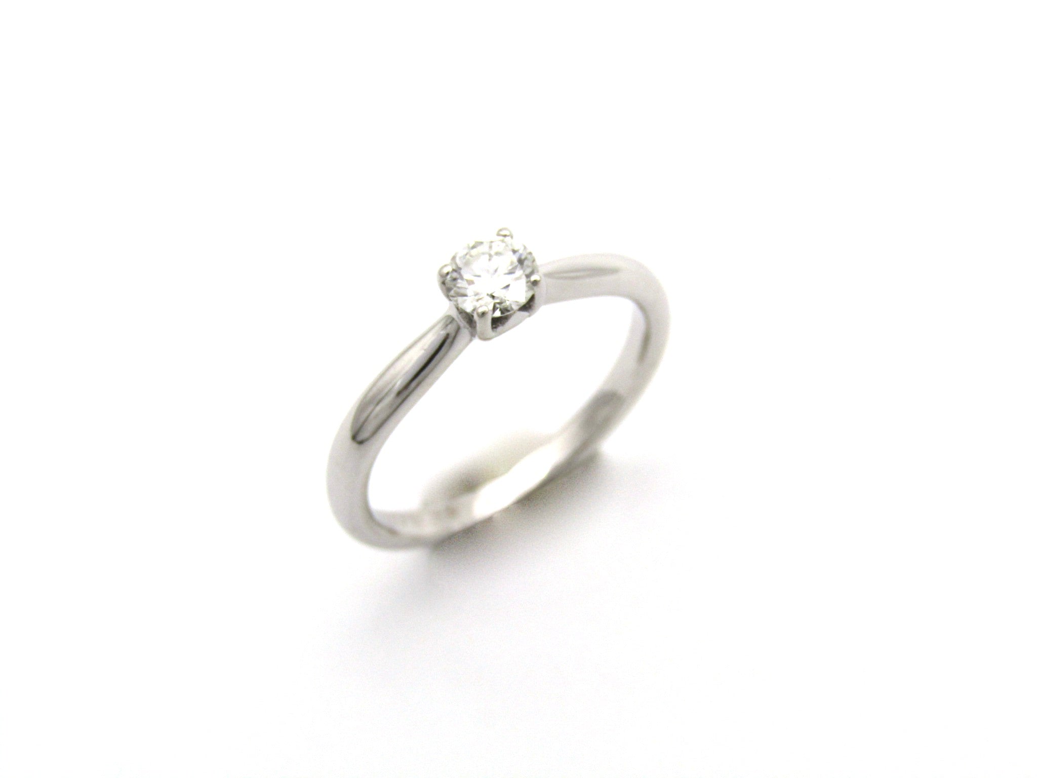 18K gold solitaire diamond ring by Browns.