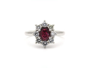 14K gold ruby and diamond halo ring.