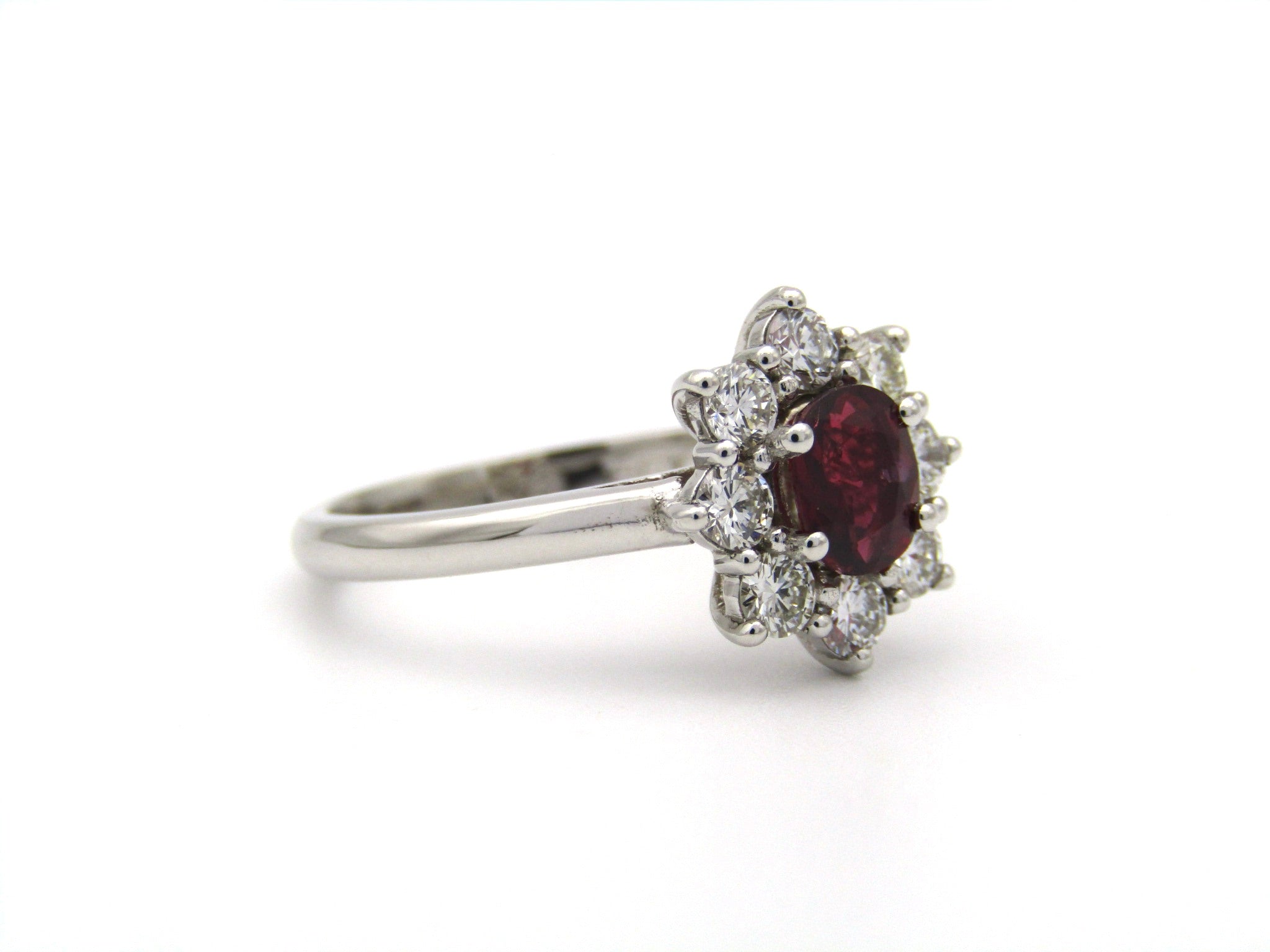 14K gold ruby and diamond halo ring.