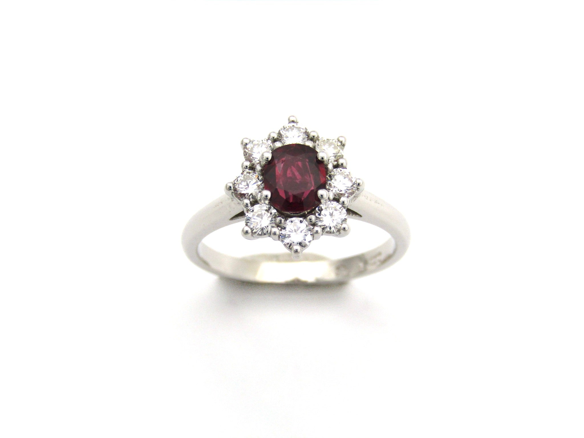 14K gold ruby and diamond halo ring.