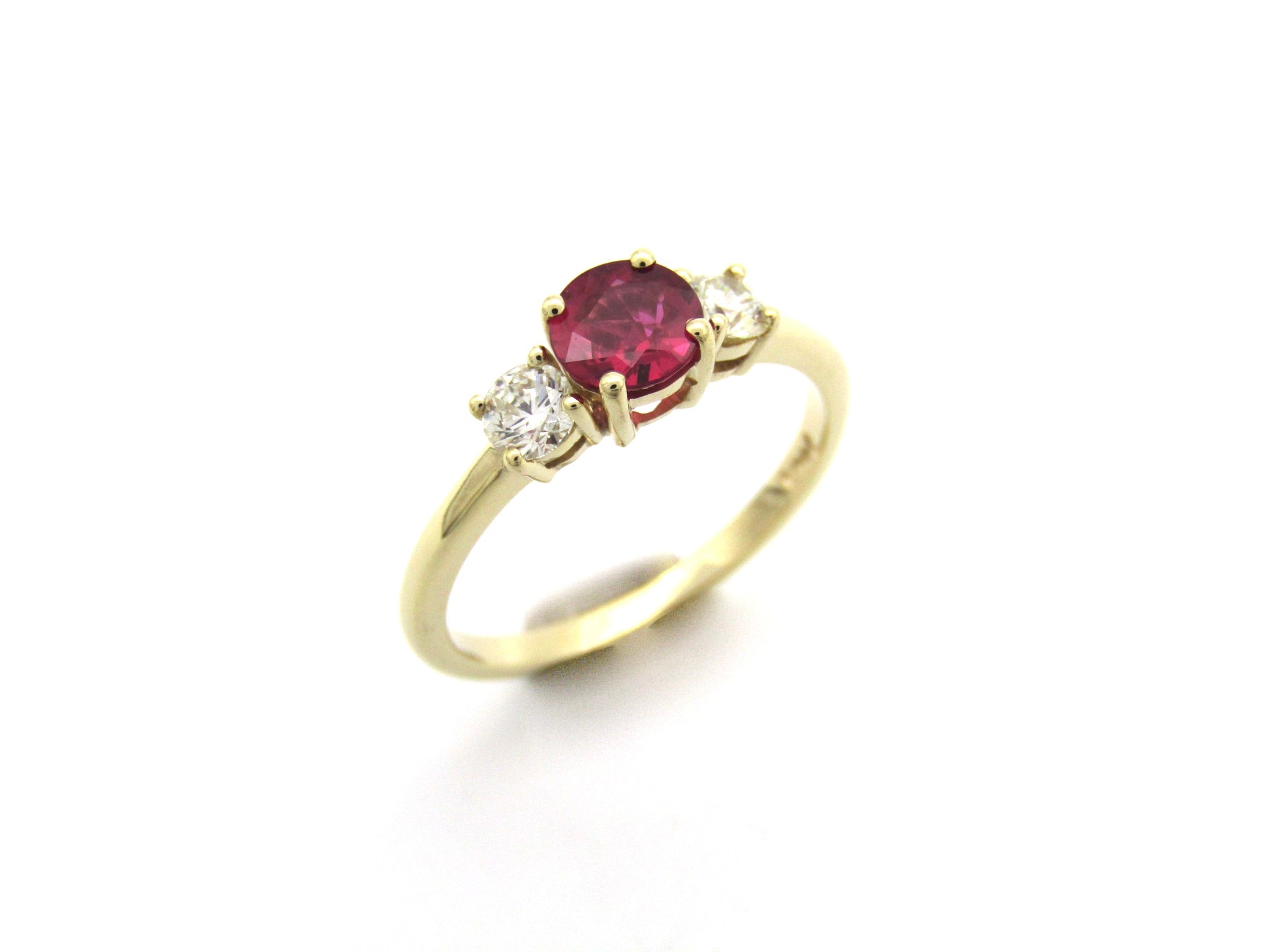 14K gold ruby and diamond trilogy ring.