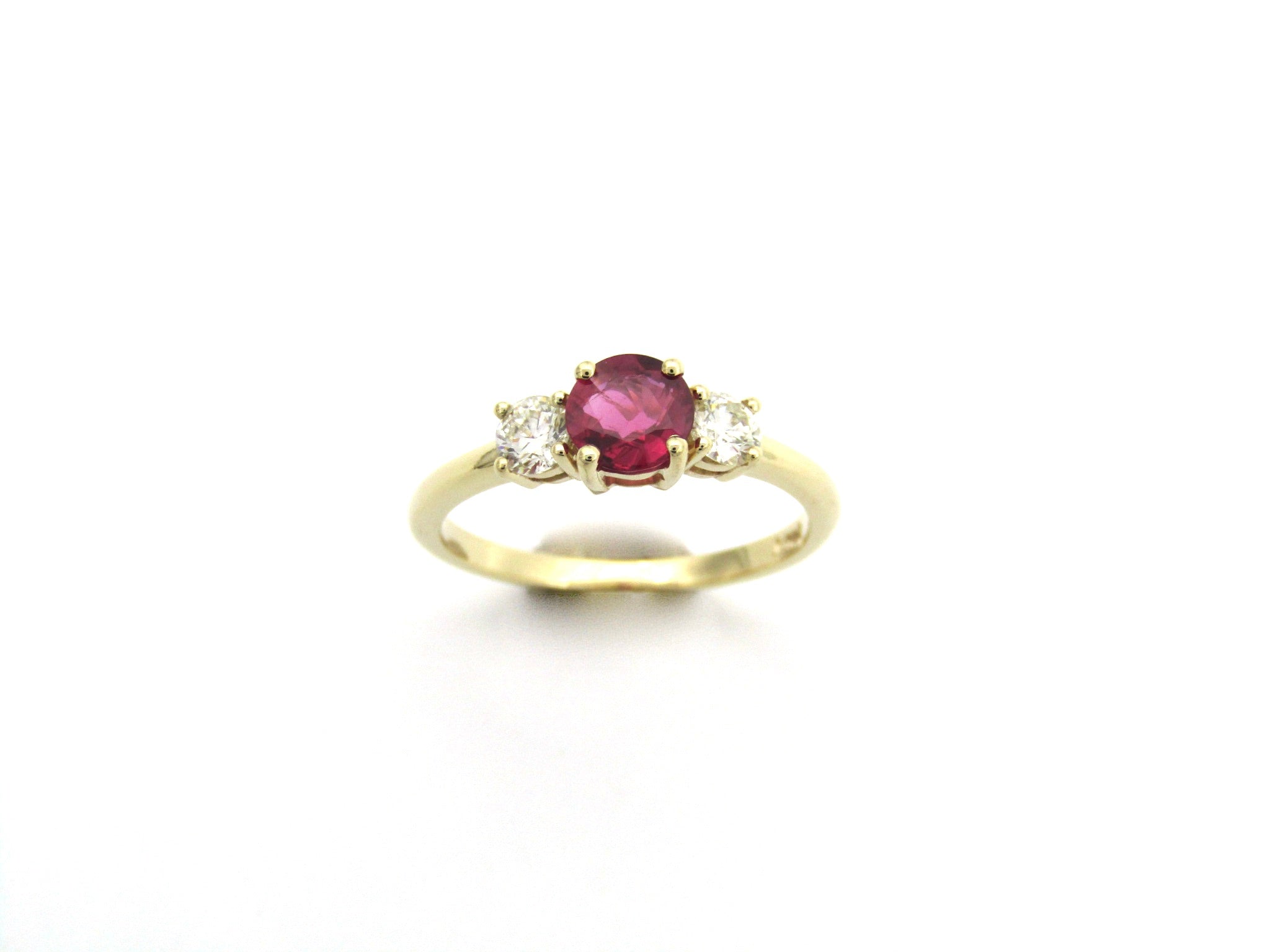 14K gold ruby and diamond trilogy ring.