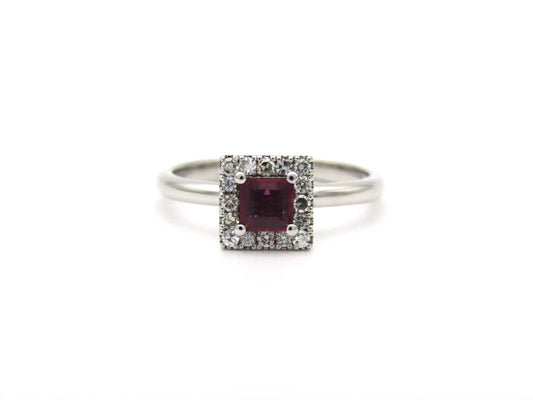 14K gold ruby and diamond halo ring.