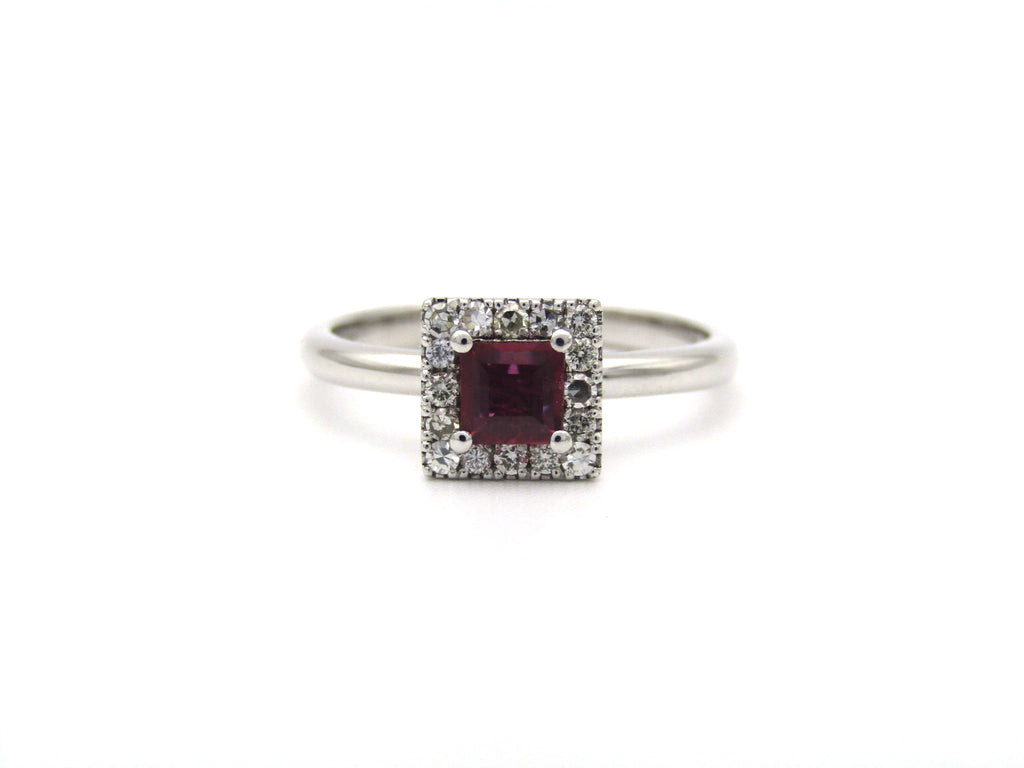 14K gold ruby and diamond halo ring.