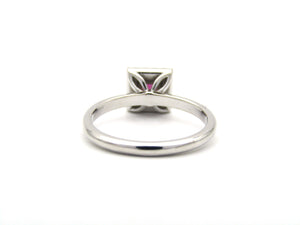 14K gold ruby and diamond halo ring.