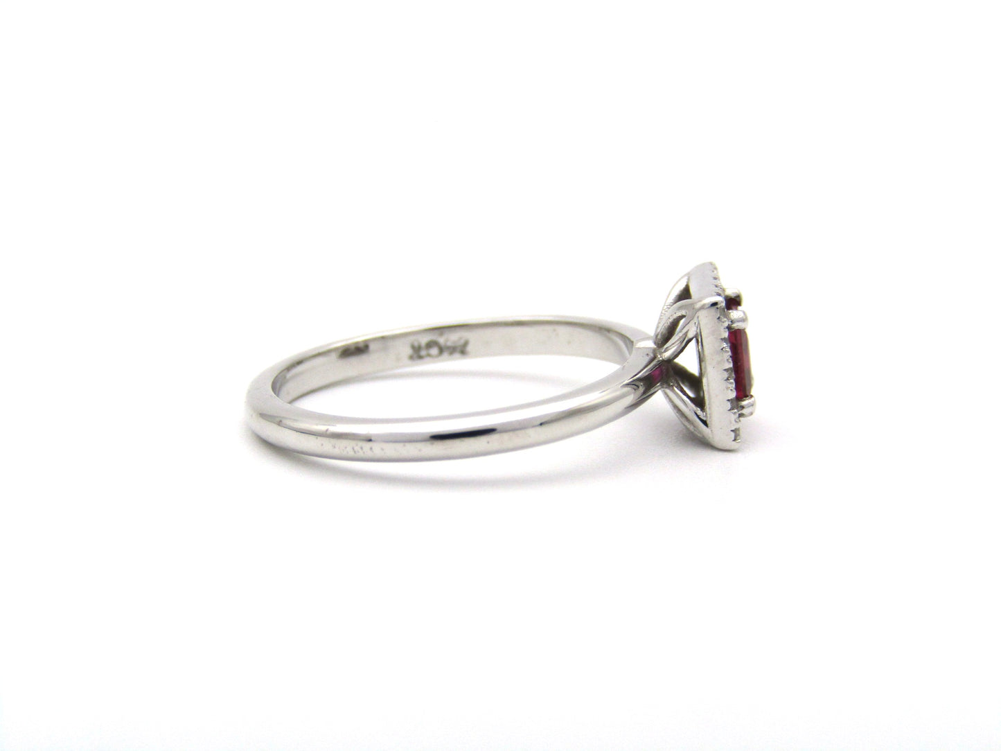 14K gold ruby and diamond halo ring.