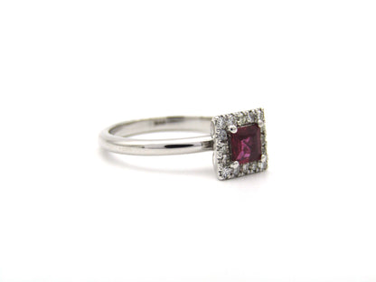 14K gold ruby and diamond halo ring.