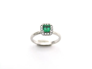 14K gold emerald and diamond halo ring.