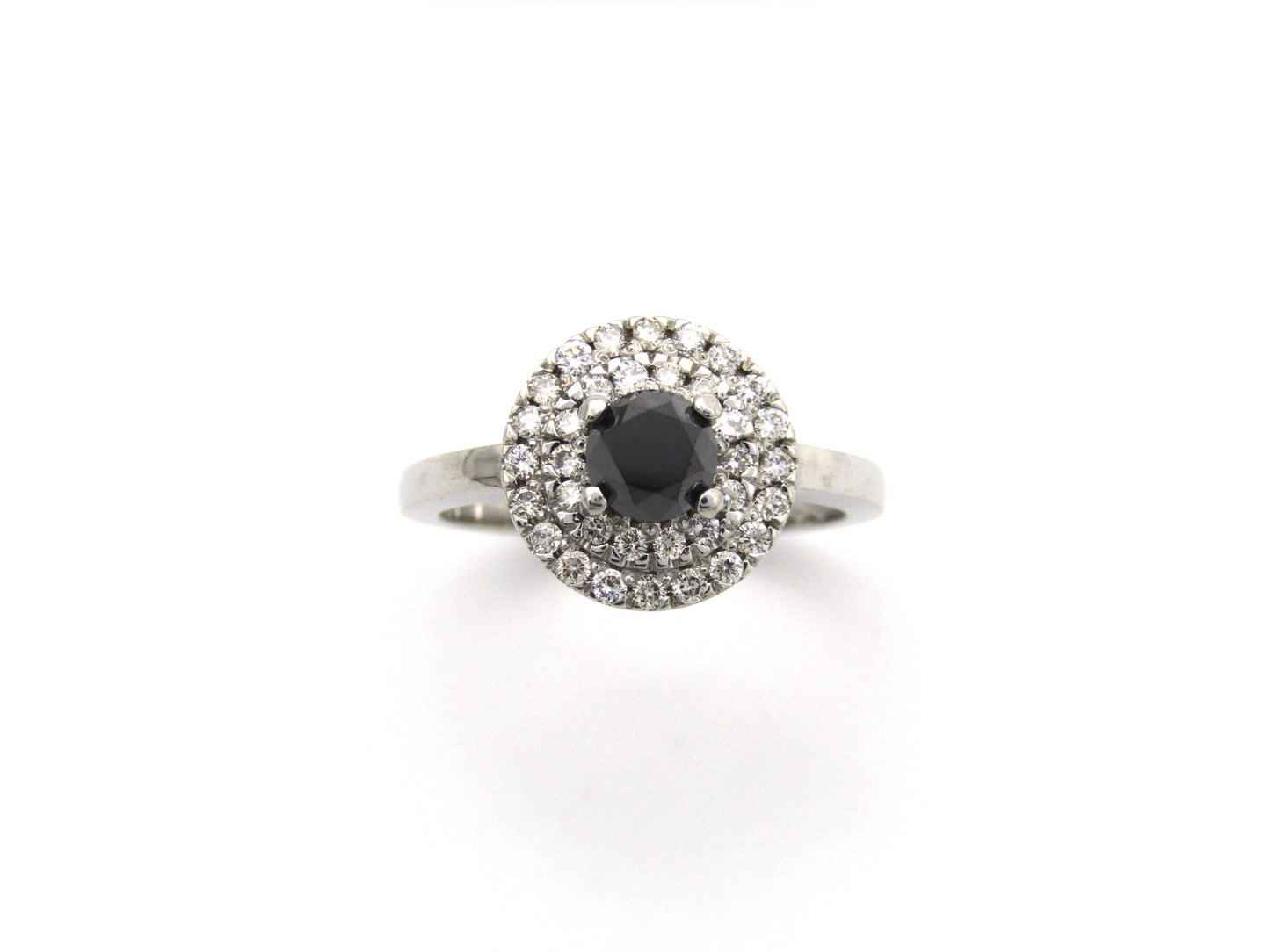 18K gold black and colourless diamond halo ring.