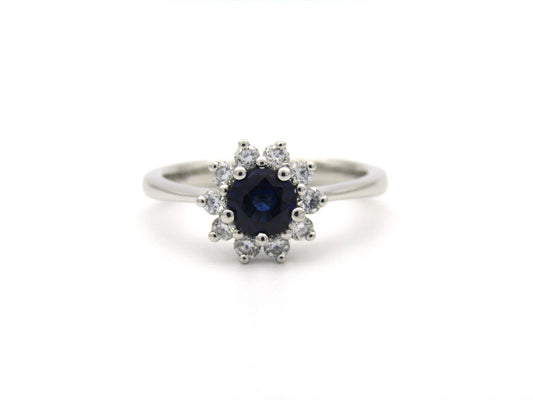 18K gold sapphire and diamond halo ring.