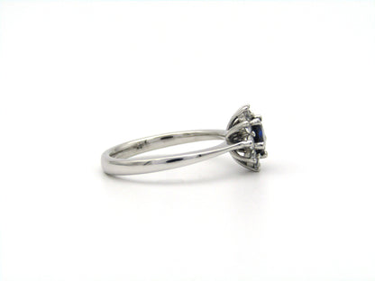 18K gold sapphire and diamond halo ring.