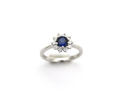 18K gold sapphire and diamond halo ring.