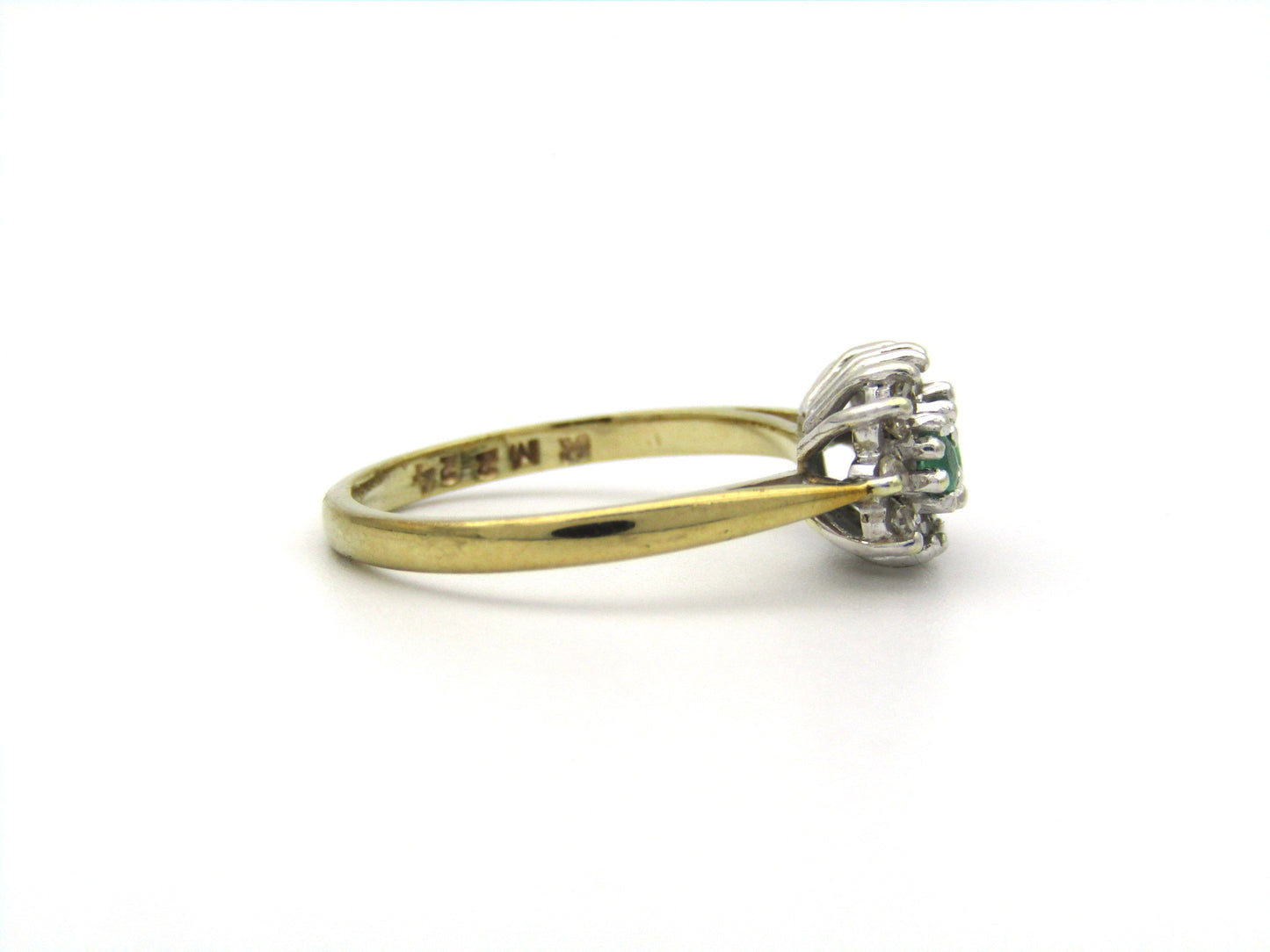 9K gold emerald and diamond ring.