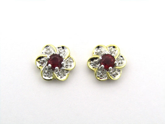 14K gold ruby and diamond flower earrings.