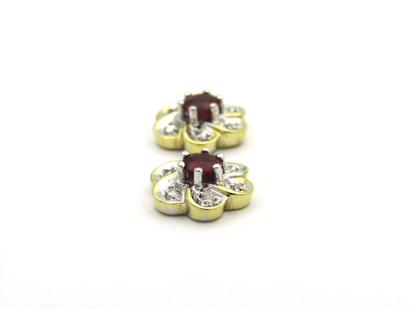 14K gold ruby and diamond flower earrings.