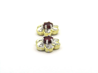 14K gold ruby and diamond flower earrings.