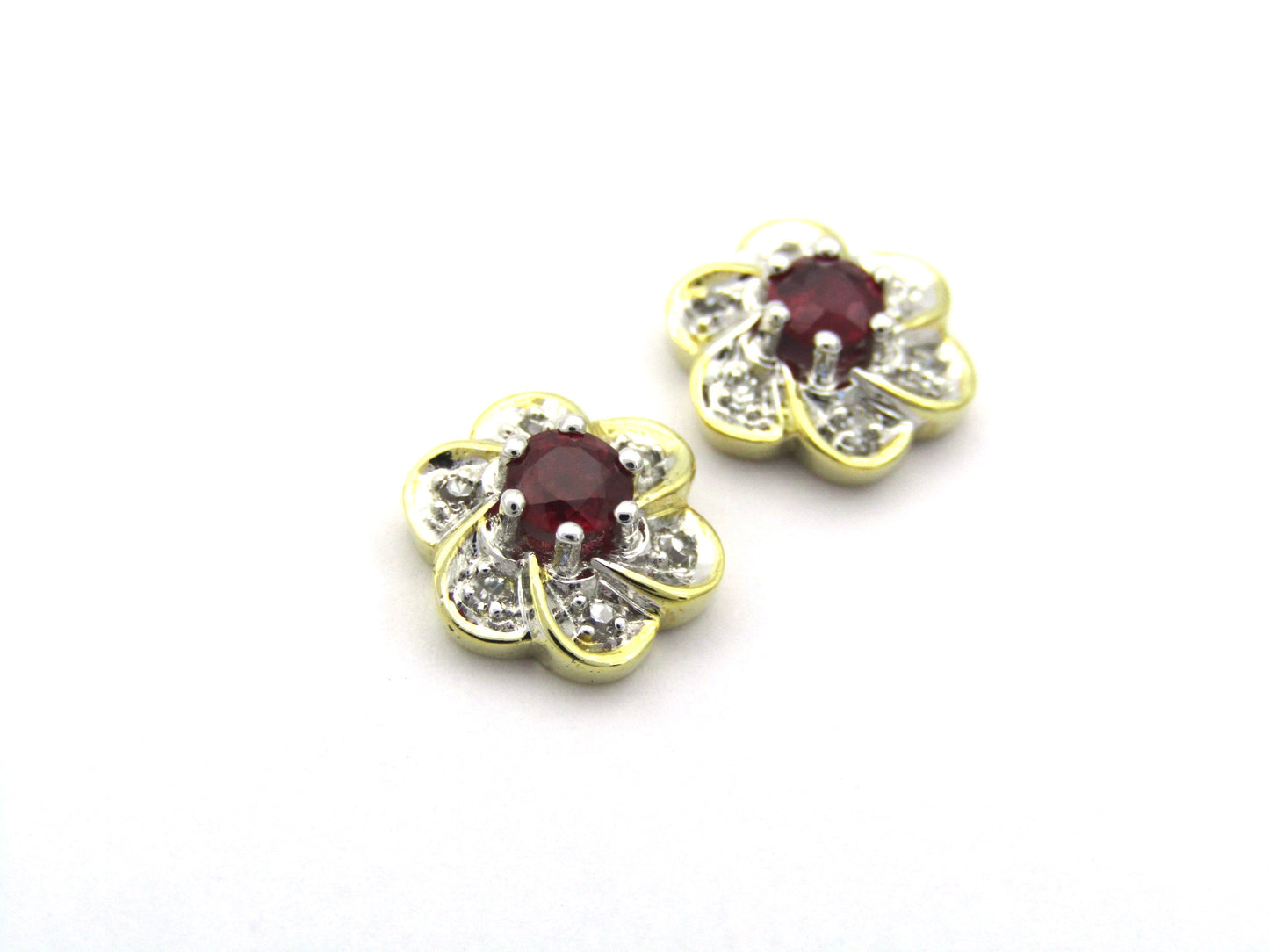 14K gold ruby and diamond flower earrings.