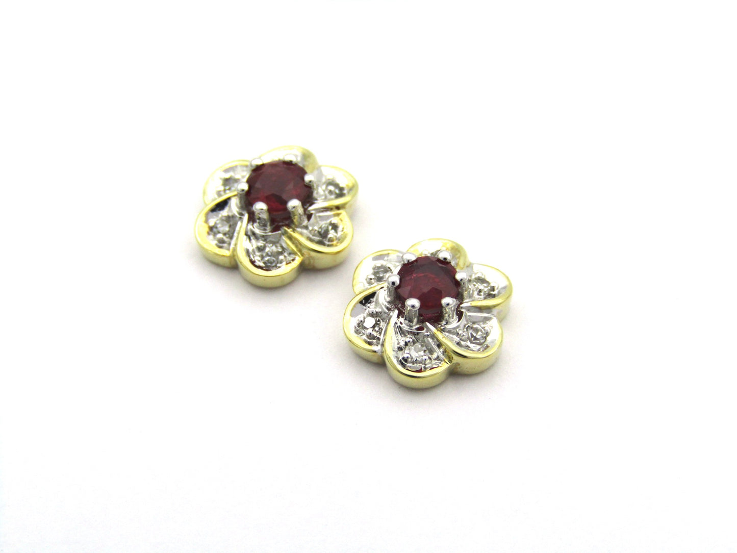 14K gold ruby and diamond flower earrings.