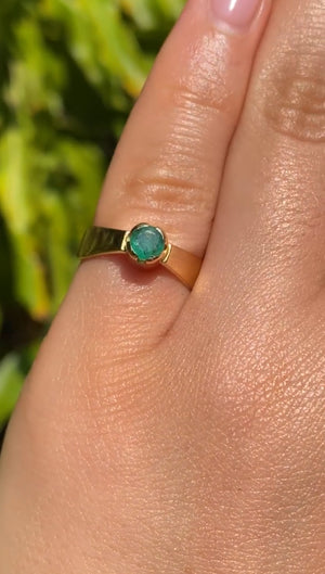 18K gold emerald ring by Erich Frey.