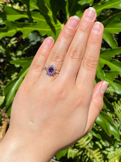 14K gold ruby and diamond halo ring.