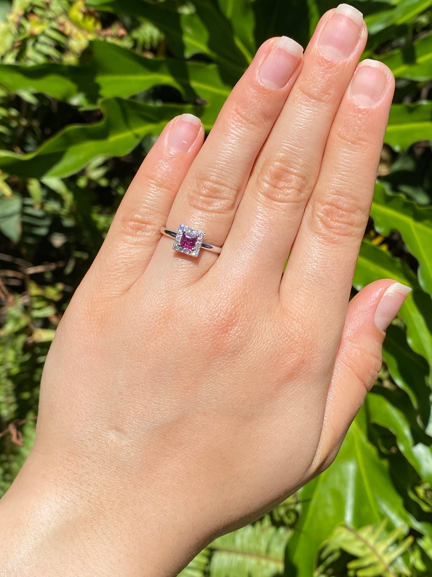 14K gold ruby and diamond halo ring.