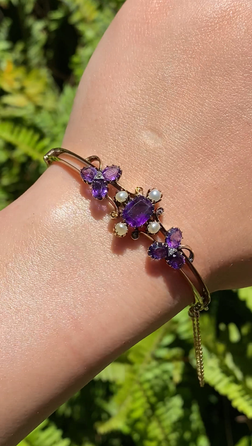 14K gold Edwardian amethyst, pearl, and diamond bangle.